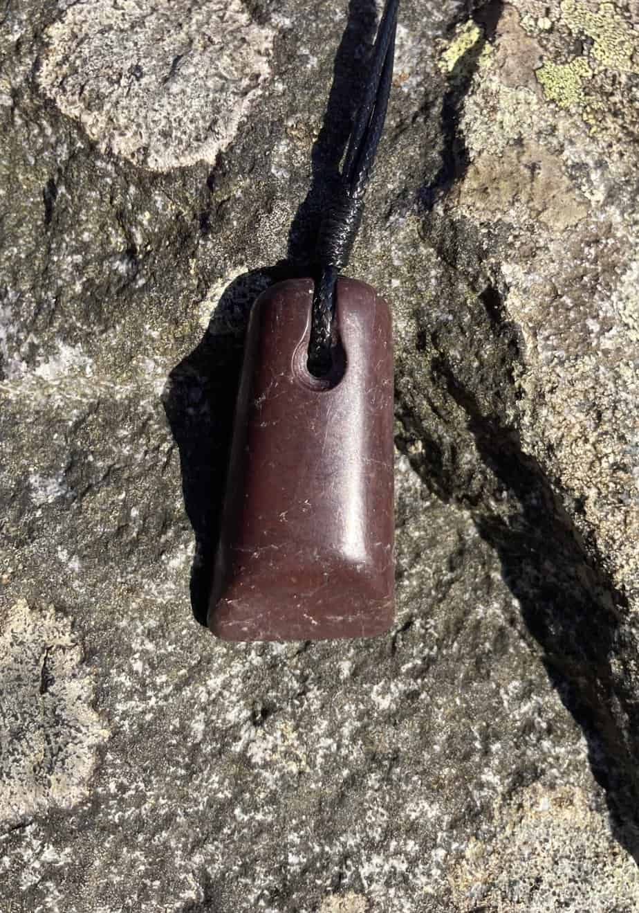 purple-brown stone pendant